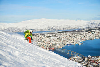 Tromsø in winter with a person skiing.