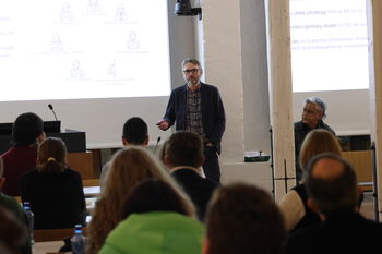 Presentation ,Outerwear ,Event ,Shirt ,Electronic device.
