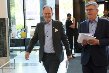 Suit trousers ,Glasses ,Smile ,Tie ,Dress shirt.